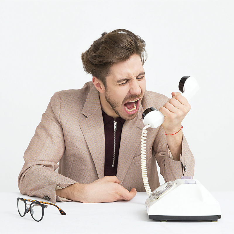 Image of man shouting down phone - image provided by Icons8 Team